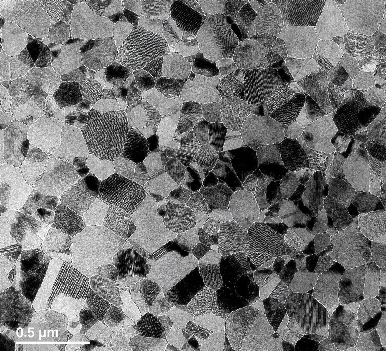 TEM bright-field image of nanocrystalline bulk copper — 3-D nanomaterial characterisation showing grain structure at 0.5 µm scale