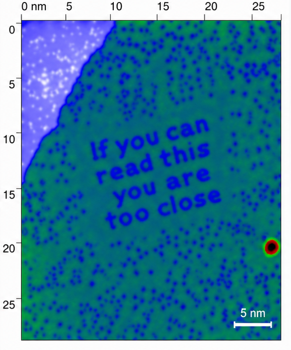 STM image of carbon monoxide molecules on copper spelling 'if you can read this you are too close' — IBM Almaden Fun With Atoms